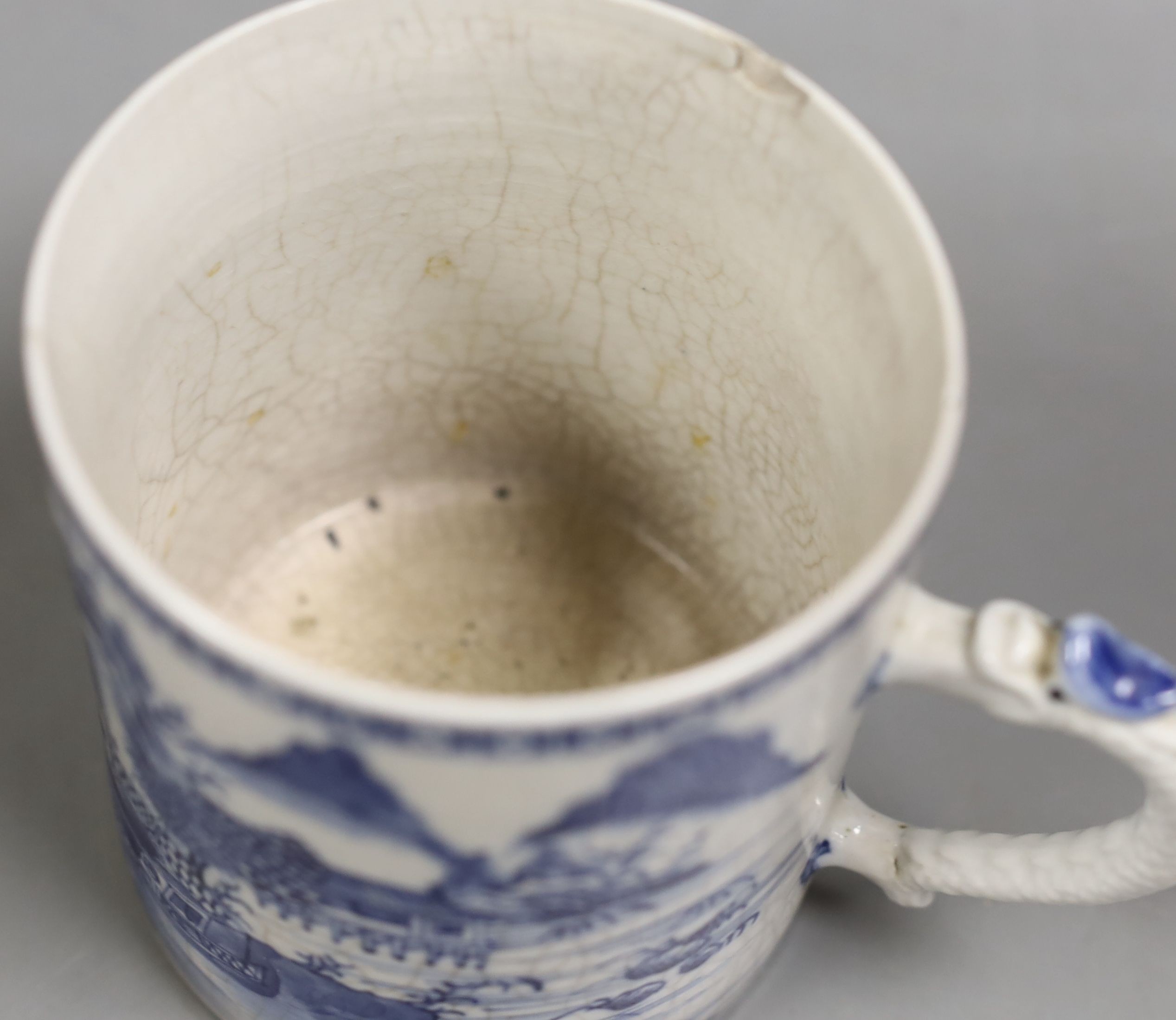 A Chinese blue and white mug, late 18th century, 11.5 cms high.